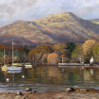 Lake District art print Autumn Morning at Waterhead by local artist Jeff Sudders. Sailing boats on the lake at Windermere with trees and mountains behind in brown and green hues.