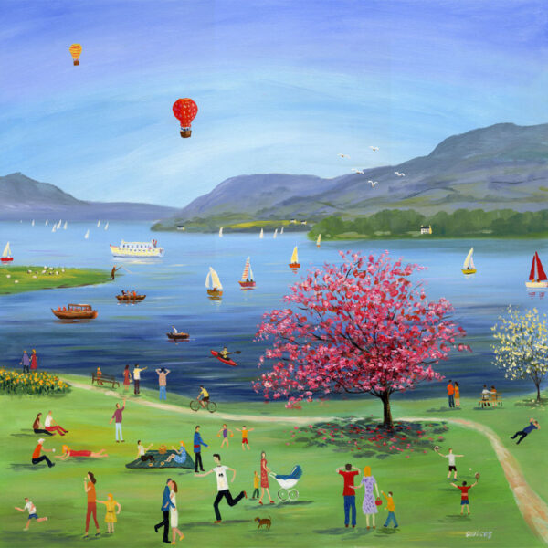 Lake District art print Bank Holiday at Borrans Park by local artist Jeff Sudders. A brightly coloured naive style painting of people in the park by the lake at Windermere with blossom tree and hot air balloons.