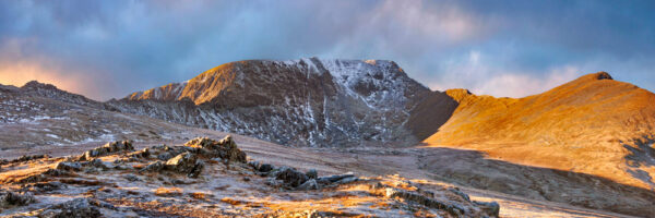 A beautiful panoramic photograph by Jon Allison of Helvellyn captured from Birkhouse Moor at sunrise.