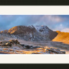 A beautiful panoramic photograph by Jon Allison of Helvellyn in snow in the lake district captured from Birkhouse Moor at sunrise.