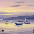 Lake District art print by Jeff Sudders. Lake Windermere in the Lake District with some yachts in the foreground and mountains in the background, sun is setting, the colours are purple, pink and blue.