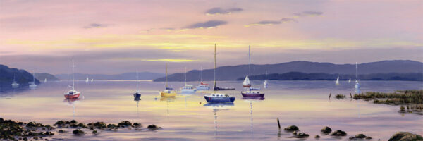 Lake District art print by Jeff Sudders. Lake Windermere in the Lake District with some yachts in the foreground and mountains in the background, sun is setting, the colours are purple, pink and blue.