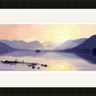 Lake District art framed print Sunrise at Derwentwater by local artist Jeff Sudders in a black frame.