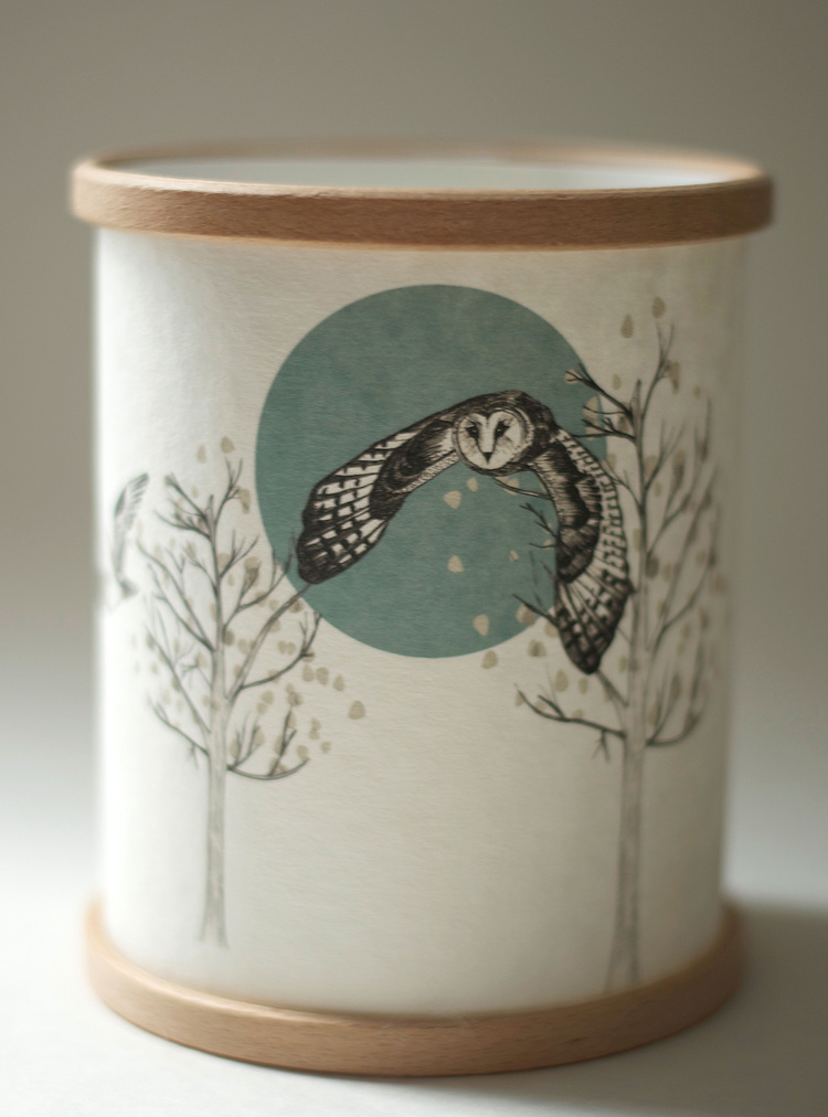 Candle Cover by A Northern Light showing an owl flying in front of a large moon with trees below