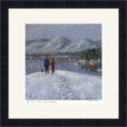 Lake District Art framed print We Love Snow Derwentwater by Jeff Sudders. Heart shaped snowflakes fall on a couple by the lake and mountains.
