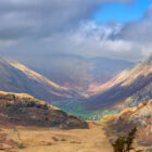lake district panormaic photograph of the langdale valley from lingmoor fell featuring langdale pikes harrison stickle pike of stickle and a cloudy sky