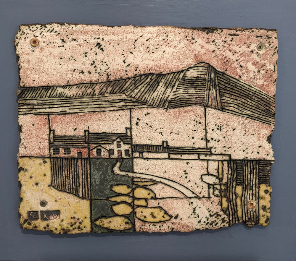 Landscape Tile by Nigel Edmondson Landscape Tile by Cumbrian sculptural artist Nigel Edmondson. Hand-built using techniques in slab construction, coiling, throwing and often both in combination. Each piece is fired to a temperature of 1250C in oxidation, ensuring his creations can endure all weathers for the years to come. Using various small slabs of clay, each with a different colouring or level of oxidization, this textured tile shows a snippet of te Lake District landscape. Showing small farmhouse amongst the fields with the fells standing tall in the distance. A simple yet beautiful use of the clay medium.