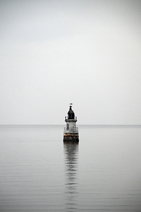 A stunning image captured by wildlife and environmental photographer Heather Marlow Stephenson, on display at Cook House Crafts in Bowness, the Lake District. A high-definition photograph printed onto aluminium dibond, suitable for bathrooms, kitchens and covered outdoor areas. Plover Scar lighthouse perfectly centred in the shot at high tide. A calm day in the bay shows the old lighthouse’s reflection on the smooth ripples of the tide.
