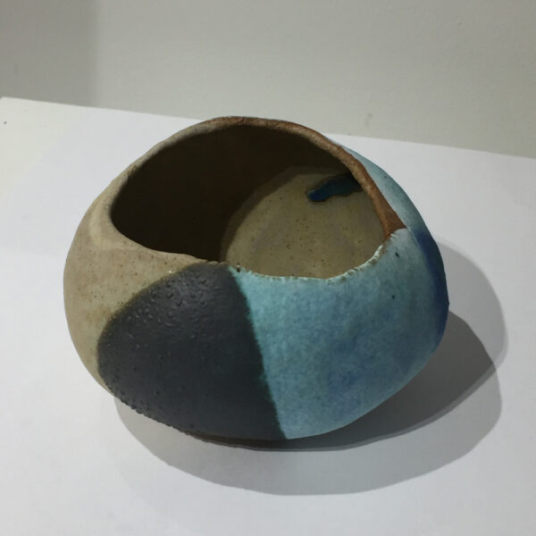 Hand-built clay candle holder by Kirsti Hannah Brown evoking the landscape