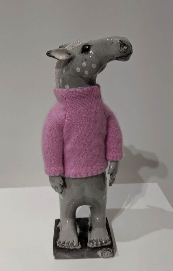 Sculpture by Gwen Vaughan of a horse with moving arms, with a handknitted cashmere jumper