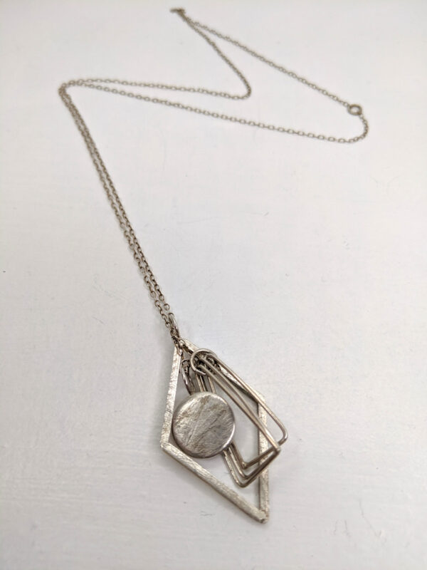Multiple Silver Triangle Pendant Necklace by Heather McDermott