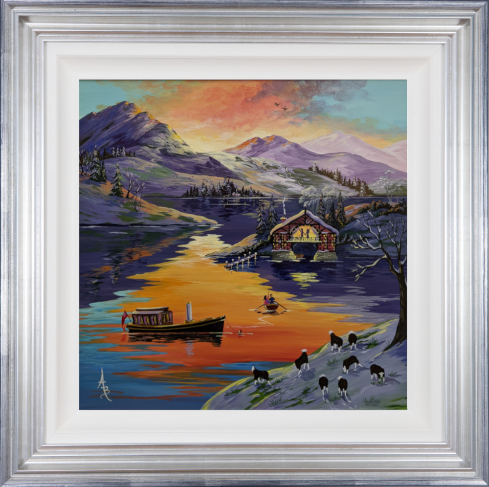An original acrylic painting by Anne Blundell inspired by a boathouse on a lake in the Lake District. the brightly coloured sunset above reflects onto the lake below over the hills. Herdwick sheep can be seen along the lakeside in the snow. Two boats are seen on the water with people waving at them from the boathouse.