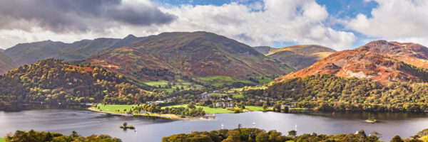 bright and sunshine view over Ullswater looking down at glenridding and up into the fells