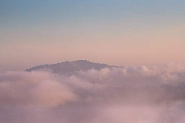 Blencathra Framed Print by Lake District Photographer Nathan Buckley. An atmospheric shot of the well know mountain near Keswick. Blencathra is emerging above the clouds in hues of pink