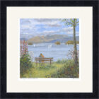 Lake District art framed print by local artist Jeff Sudders. A couple enjoy the view of Windermere from bench by the lake at Bowness.
