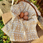 Organic Cotton tea towel in Miller Honeyman's bunny & bird design in straw.