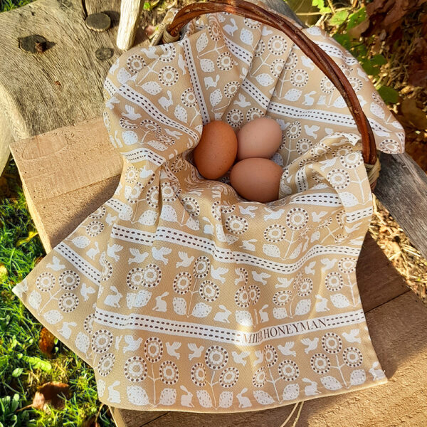 Organic Cotton tea towel in Miller Honeyman's bunny & bird design in straw.
