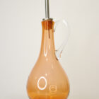 A Handcrafted glass Oil pourer in aurora colour handmade in Britain by Loco Glass LTD.