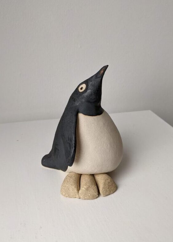 Handmade in Britain clay penguins from crafter Louise O'Connor.