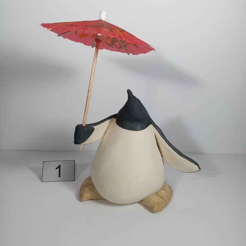 Handmade in Britain clay penguins from crafter Louise O'Connor.
