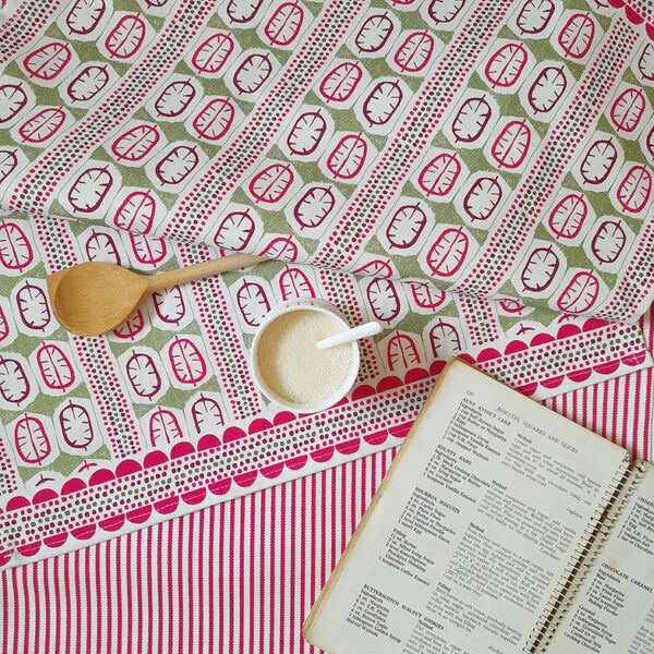 Honesty Seed Organic Cotton Tea Towel by local textile designer Miller Honeyman in pink and green.