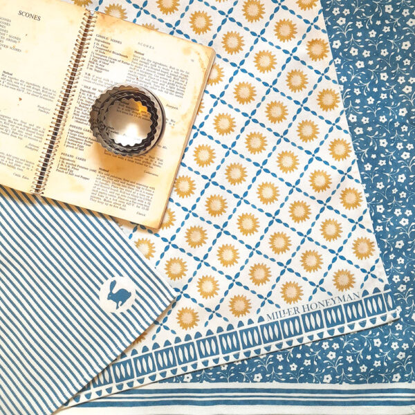 Organic cotton tea towel in blue sunburst design by Miller Honeyman