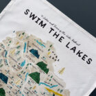 Swim the lakes tea towel by Oldfield design co created in Cumbria.