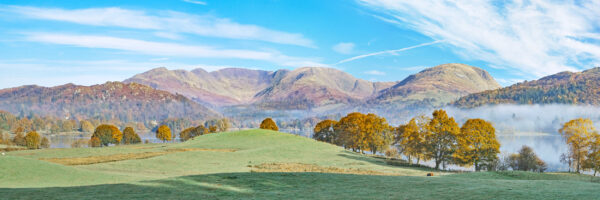 lake district art photographic photography print of the view towards fairfield horseshoe from wray castle over lake windermere in autumn with rising mist on the lake