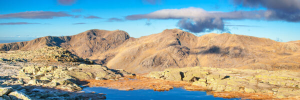 lake district art photography by local photographer jon allison dawn in winter view across eskdale from langdale to scafell pike with blue skies