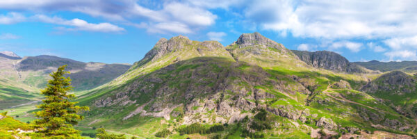lake district art landscape photography by jon allison a wide scene of the langdale pikes and mickleden valley seen from lingmoor fell on a sunny spring day - rich green colours and dappled sunlight