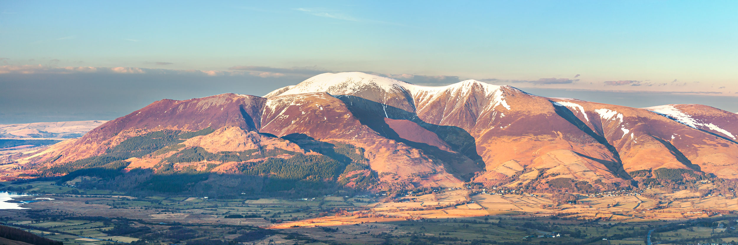 Jon Allison - Skiddaw at Dawn lake district art landscape photography by jon allison high view down to Skiddaw at Dawn with snow capped mountains and warm light