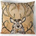 Golden Monarch Stag cushion by Dawn Maciocia on faux suede