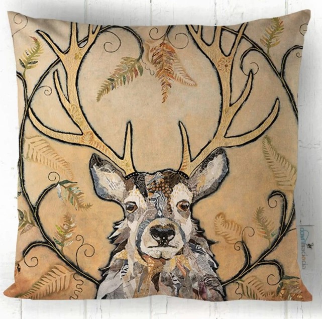 Golden Monarch Stag cushion by Dawn Maciocia on faux suede