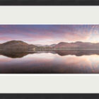 Lake District Art Photographer Print by local artist Nathan Buckley. evening colour over ullswater lake with sunset over hallin fell high street high dodd place fell