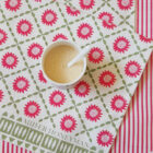 Sunburst Pink organic cotton tea towel by local textile designer Miller honeyman in a lattice pattern of pink and green.