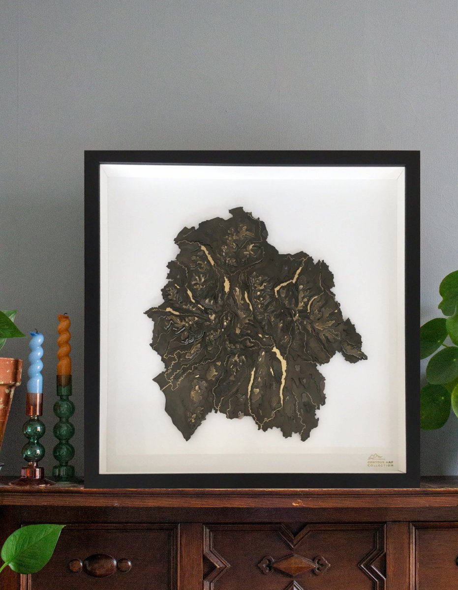 laser cut polished brass aerial artwork of the lake district national park in cumbria framed 3D art