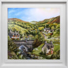 Lake District art original Acrylic painting by Caroline Deighton. Five minute rest featuring couple resting on bridge with stream below a few houses near by-hills with green fields and trees and blue skies. Displayed in white frame.