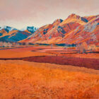 Art print by Lake District artist Libby Edmondson of Langdale Plain featuring the langdale pikes and valley in orange autumn tones