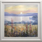 Lake District art original oil painting by local artist Jeff Sudders. A beautiful sunset scene yellow and pink skies with the sun reflecting across the lake. Blossoming flowers in the fields. In a white frame.