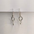 Handcrafted silver earrings featuring a delicate raindrop pendant. Approximately 1.75” in length.