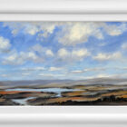 Lake District art original oil painting by Jeff Sudders. Afternoon Sky featuring blue cloudy skies orange and earth tone fields below with a lake and fells in the distance. Displayed in a white cushioned frame.