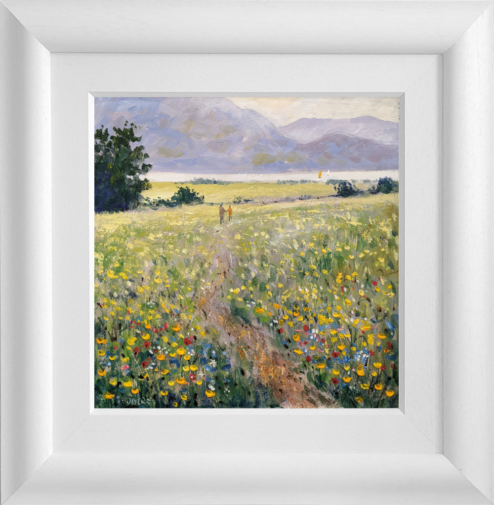 Lake District art original oil painting by Jeff Sudders featuring afternoon stroll. Fields of multi coloured flowers a couple walking along the footpath. Lake and fells in the distance. Displayed in a white wood grain frame.