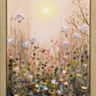 Textured floral meadow painting with delicate blooms rising above wildflowers, scattered petals, butterflies, and twisting stems beneath a soft glowing sun. The artwork features a pastel pink background and expressive palette-knife details, creating a dreamy, whimsical garden scene. Displayed in a light oak tray frame.