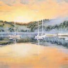 A limited edition print on canvas by Ben Goymour featuring lake Windermere during sunset. Water is still showing the reflection of hills and orange skies. Sailboats floating on the lake.