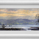 Lake District art original oil painting by Jeff Sudders. A clouded sunset and calm waters on Lake Windermere sailboat silhouettes in the distance. A calm piece. Displayed in a white cushioned frame.