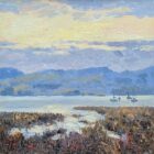 A soft, impressionistic landscape painting showing a calm lake at sunset. Three small sailboats rest on still water, reflecting the pastel sky. In the foreground, tall reeds and marsh plants in earthy browns and purples frame the scene. Rolling blue‑green hills rise in the distance beneath a sky painted with gentle yellows, blues, and lavender tones.