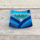 Inspired by the iconic Lotus flower this handmade large dish is made using rich expressive blue and turquoise coloured glass and finished with delicate hand-painted details.