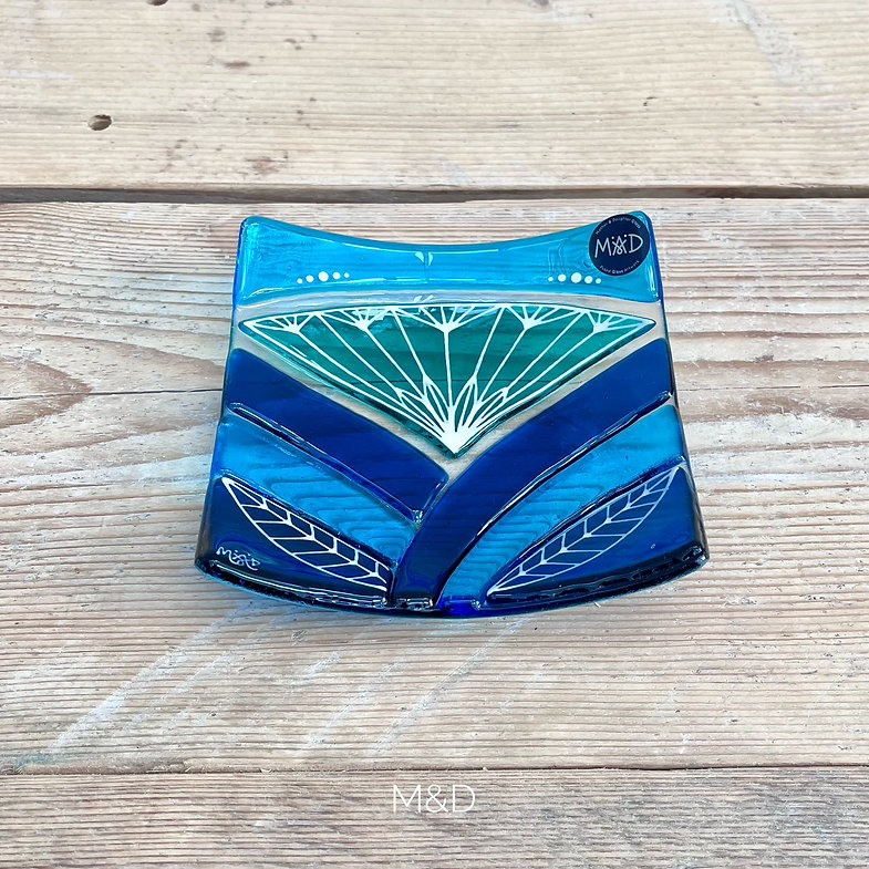 Inspired by the iconic Lotus flower this handmade large dish is made using rich expressive blue and turquoise coloured glass and finished with delicate hand-painted details.