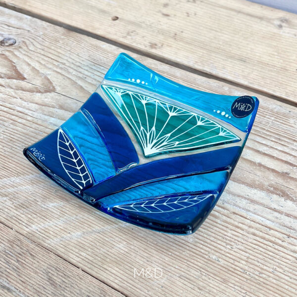 Inspired by the iconic Lotus flower this handmade large dish is made using rich expressive blue and turquoise coloured glass and finished with delicate hand-painted details.