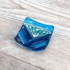 Lotus design fused glass ring dish inspired by the iconic Lotus flower. Made using vibrant coloured glass crafted into simple shapes with hand painted designs.